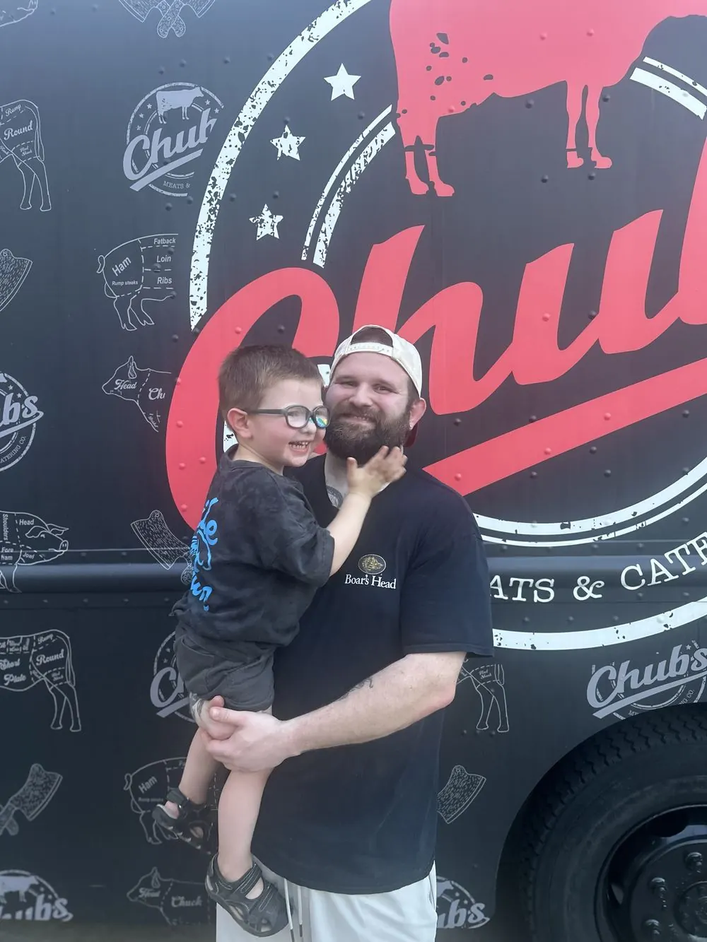 Tom and his son in front of the Chubs food truck